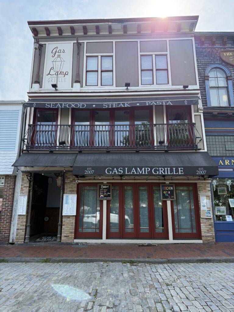 Gas Lamp Grille exterior on Thames Street with gas lamp sign at the entrance.